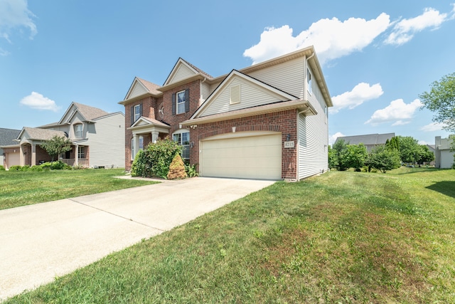 4215 Chandi Ct, Ypsilanti, MI 48197 - traditional home with a garage, a front yard, driveway, and brick siding