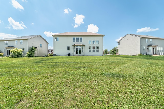 4215 Chandi Ct, Ypsilanti, MI 48197 - rear view of house with a yard