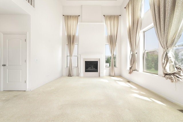 4215 Chandi Ct, Ypsilanti, MI 48197 - unfurnished living room with carpet and a glass covered fireplace