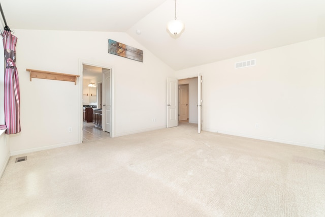4215 Chandi Ct, Ypsilanti, MI 48197 - empty room with light colored carpet and high vaulted ceiling