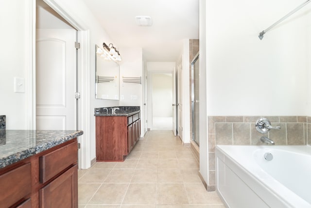 4215 Chandi Ct, Ypsilanti, MI 48197 - full bathroom with vanity, a garden tub, tile patterned flooring, and a stall shower