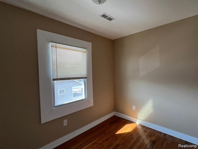 6349 Barlum St, Detroit, MI 48210 - spare room featuring baseboards and dark wood-type flooring
