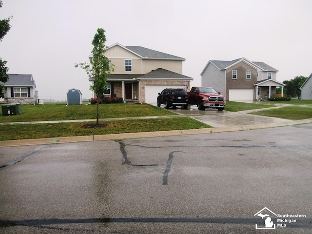 7844 Kreps Dr, Monroe, MI 48162 - traditional-style home with driveway, a front yard, and a garage