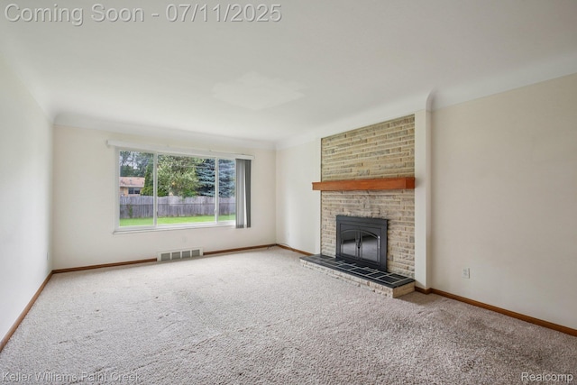 36819 Maas Dr, Sterling Heights, MI 48312 - unfurnished living room with carpet and a brick fireplace