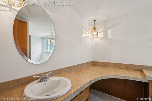 36819 Maas Dr, Sterling Heights, MI 48312 - bathroom featuring a chandelier, vanity, and tile patterned flooring