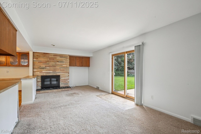 36819 Maas Dr, Sterling Heights, MI 48312 - unfurnished living room with light carpet and a large fireplace