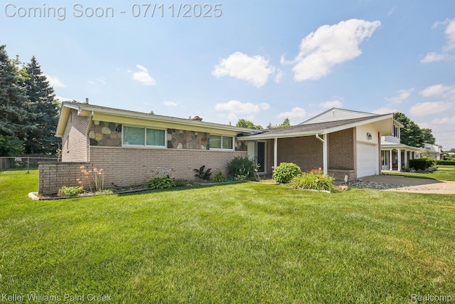 36819 Maas Dr, Sterling Heights, MI 48312 - view of front of property with brick siding, an attached garage, and concrete driveway
