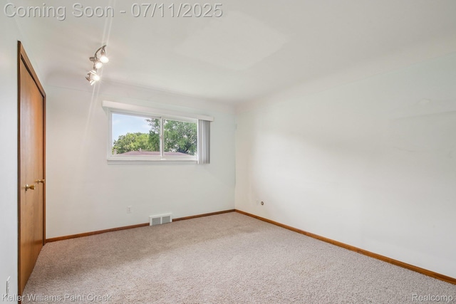 36819 Maas Dr, Sterling Heights, MI 48312 - unfurnished bedroom featuring carpet and track lighting
