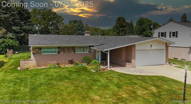 36819 Maas Dr, Sterling Heights, MI 48312 - view of front of property featuring an attached garage, brick siding, a front lawn, and driveway