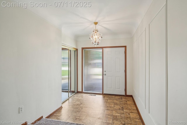 36819 Maas Dr, Sterling Heights, MI 48312 - entryway featuring a chandelier and stone finish flooring