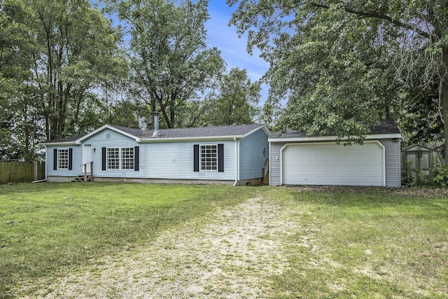 13114 Brockway Blvd, Vicksburg, MI 49097 - view of front of property featuring a garage, an outbuilding, a front yard, crawl space, and roof with shingles