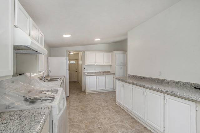13114 Brockway Blvd, Vicksburg, MI 49097 - kitchen with under cabinet range hood, white cabinetry, recessed lighting, freestanding refrigerator, and stove