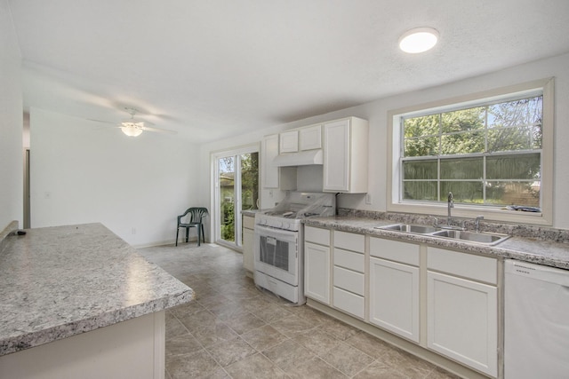 13114 Brockway Blvd, Vicksburg, MI 49097 - kitchen with white appliances, under cabinet range hood, plenty of natural light, and a ceiling fan