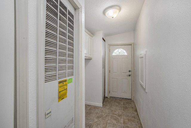 13114 Brockway Blvd, Vicksburg, MI 49097 - doorway to outside featuring a heating unit and baseboards