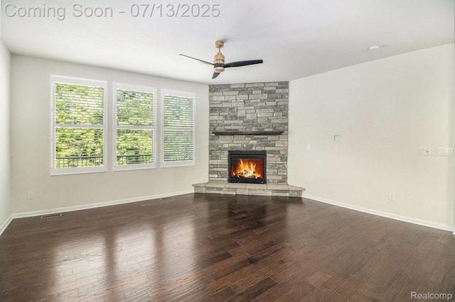 4104 Ashdale Way, Clarkston, MI 48348 - unfurnished living room with wood finished floors, ceiling fan, and a stone fireplace