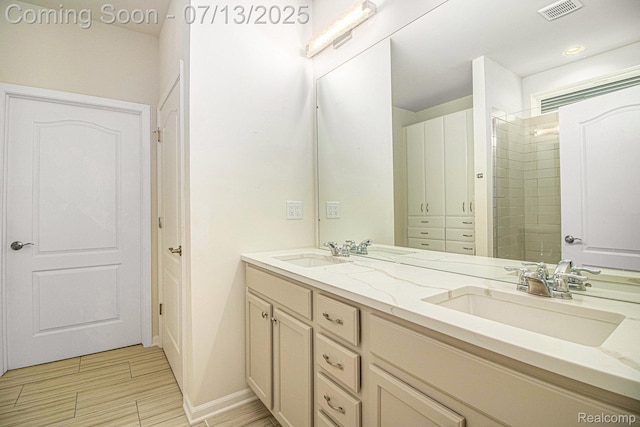 4104 Ashdale Way, Clarkston, MI 48348 - bathroom with double vanity and a tile shower
