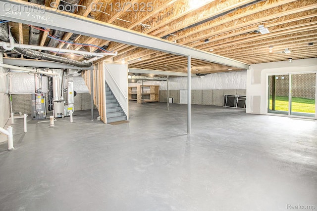 4104 Ashdale Way, Clarkston, MI 48348 - below grade area featuring gas water heater, stairway, and heating unit