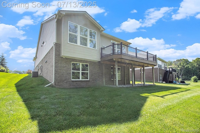 4104 Ashdale Way, Clarkston, MI 48348 - rear view of property with brick siding, a deck, and a yard