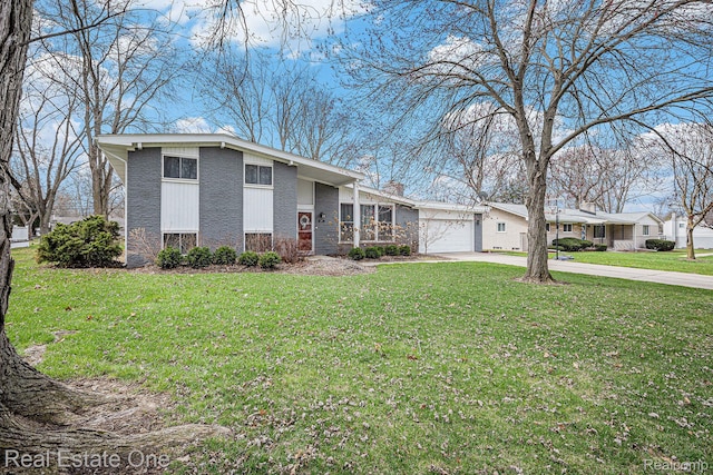 8477 Church Rd, Grosse Ile, MI 48138 - view of front of house with driveway, a garage, a front yard, and stone siding