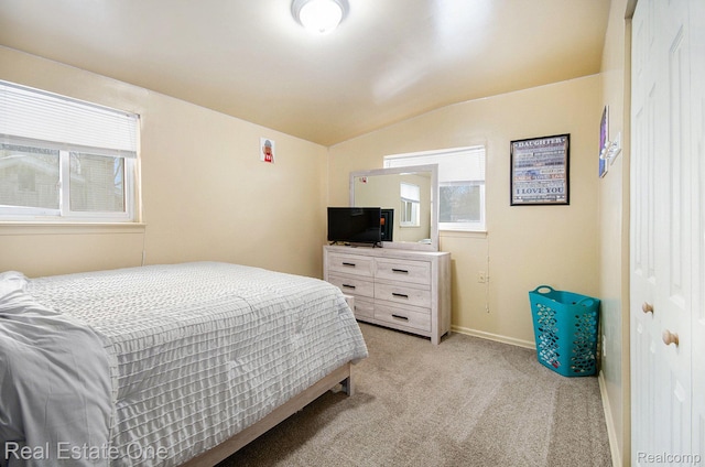 8477 Church Rd, Grosse Ile, MI 48138 - bedroom featuring lofted ceiling and light colored carpet