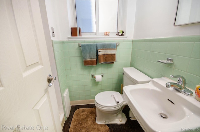 8477 Church Rd, Grosse Ile, MI 48138 - bathroom featuring tile walls, wainscoting, and wood finished floors