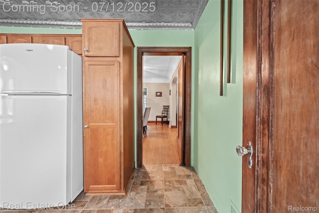 115 Illinois Ave, Pontiac, MI 48341 - kitchen featuring freestanding refrigerator and stone finish flooring