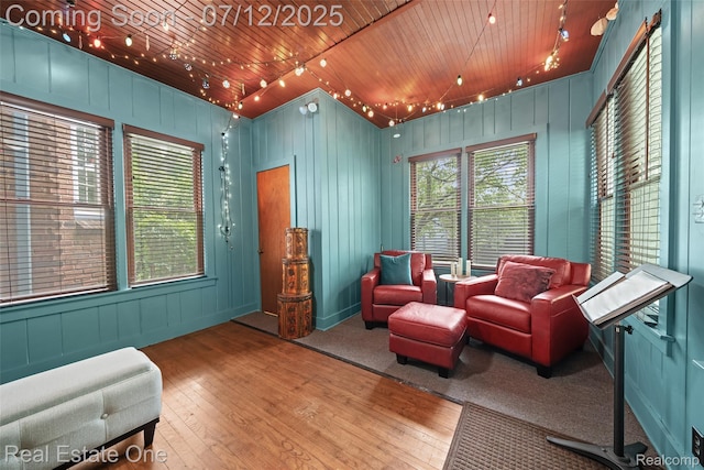 115 Illinois Ave, Pontiac, MI 48341 - sitting room with hardwood / wood-style floors, wooden ceiling, and a decorative wall