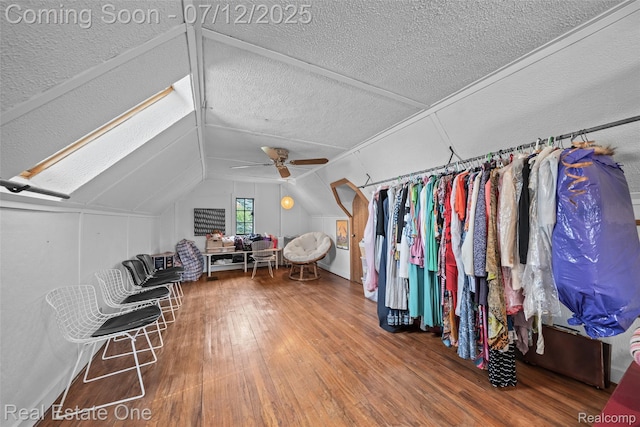 115 Illinois Ave, Pontiac, MI 48341 - additional living space with hardwood / wood-style flooring, lofted ceiling, a ceiling fan, and a textured ceiling