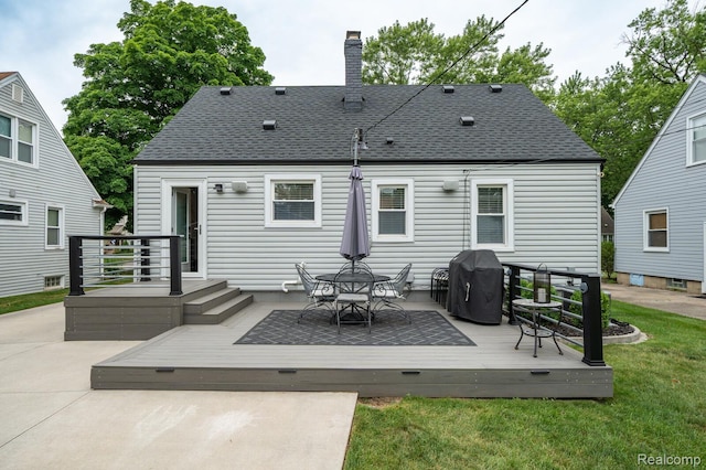 2220 Cummings Ave, Berkley, MI 48072 - rear view of property featuring a chimney, a shingled roof, a wooden deck, and a lawn