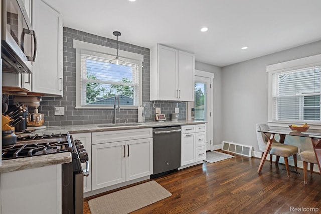 2220 Cummings Ave, Berkley, MI 48072 - kitchen with stainless steel appliances, healthy amount of natural light, tasteful backsplash, and recessed lighting