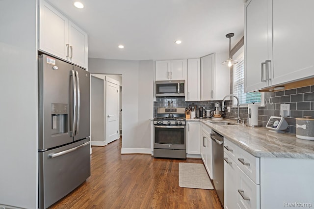 2220 Cummings Ave, Berkley, MI 48072 - kitchen with stainless steel appliances, white cabinets, light stone counters, dark wood finished floors, and recessed lighting