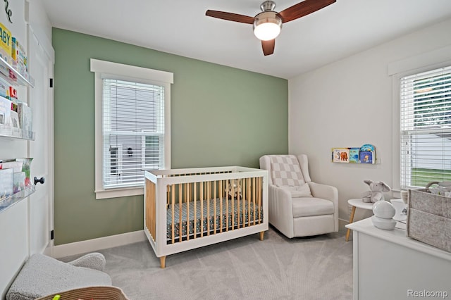 2220 Cummings Ave, Berkley, MI 48072 - bedroom featuring a nursery area, light colored carpet, and a ceiling fan