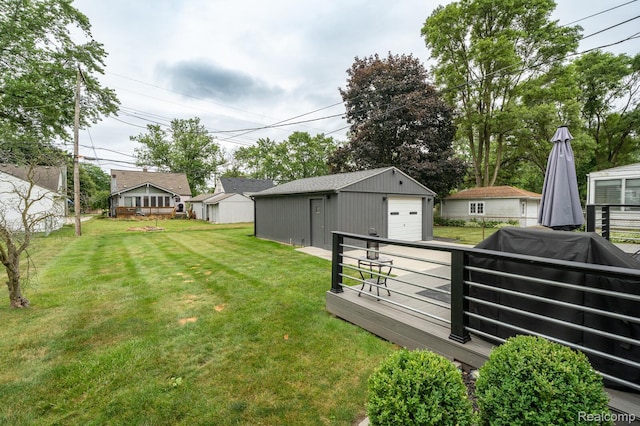 2220 Cummings Ave, Berkley, MI 48072 - view of green lawn with a detached garage, an outbuilding, and driveway