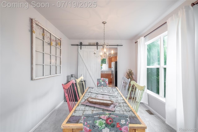 1884 Autumn Glen Dr, Howell, MI 48843 - carpeted dining area featuring healthy amount of natural light, a barn door, and a chandelier