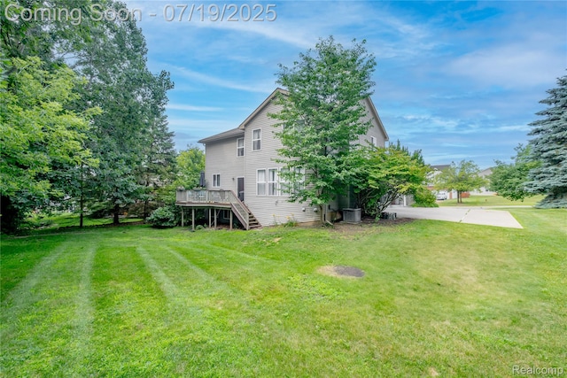 1884 Autumn Glen Dr, Howell, MI 48843 - view of green lawn featuring stairway and a wooden deck