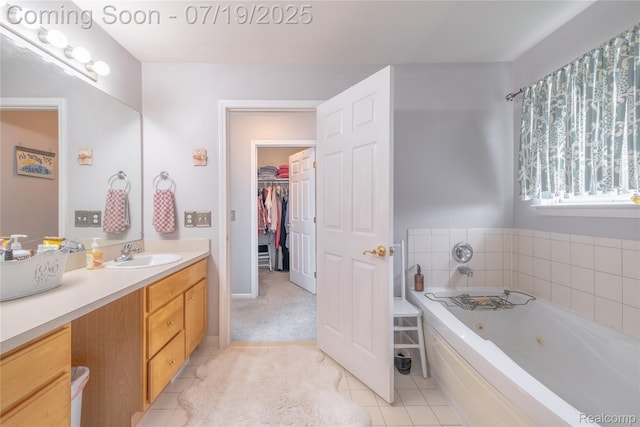 1884 Autumn Glen Dr, Howell, MI 48843 - bathroom featuring vanity, a jetted tub, tile patterned floors, and a spacious closet