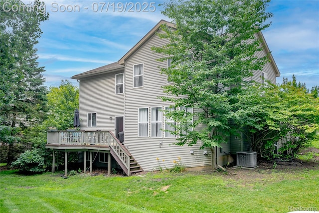 1884 Autumn Glen Dr, Howell, MI 48843 - back of property featuring a deck, a lawn, and stairs