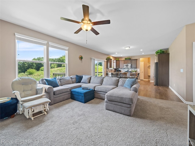 2838 Bogues View Dr, Howell, MI 48843 - living area featuring a ceiling fan, carpet flooring, and recessed lighting