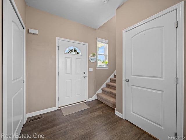 2838 Bogues View Dr, Howell, MI 48843 - foyer featuring dark wood finished floors and stairway