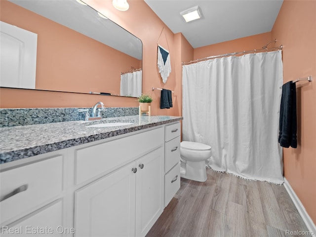 2838 Bogues View Dr, Howell, MI 48843 - full bathroom with wood finished floors, vanity, and a shower with curtain