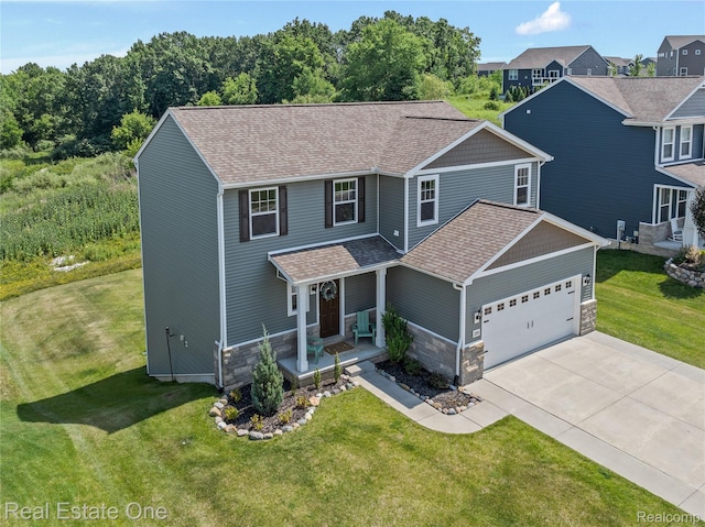 2838 Bogues View Dr, Howell, MI 48843 - view of front of house with stone siding, an attached garage, driveway, roof with shingles, and a front yard