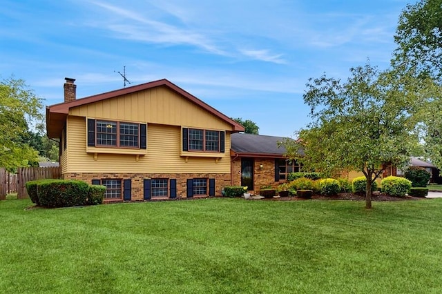 1330 Desmond St, Saint Joseph, MI 49085 - split level home featuring a chimney and brick siding