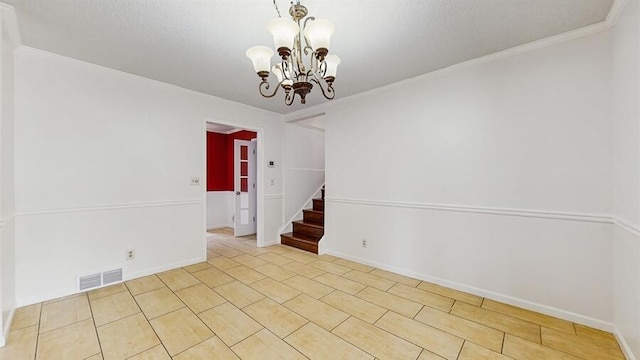 1330 Desmond St, Saint Joseph, MI 49085 - spare room with a chandelier, stairs, tile patterned flooring, and crown molding