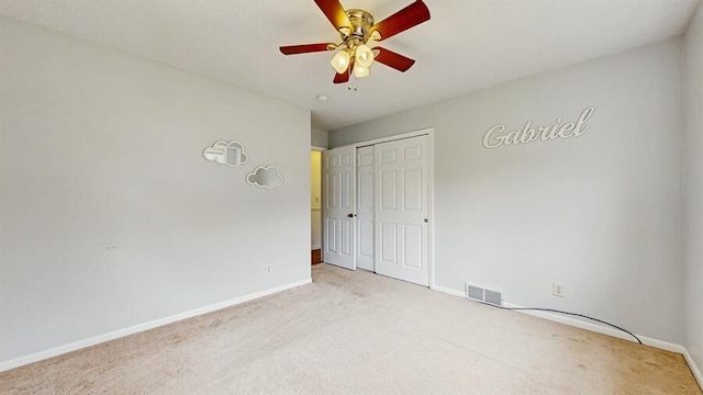 1330 Desmond St, Saint Joseph, MI 49085 - unfurnished bedroom with carpet flooring, a closet, and a ceiling fan