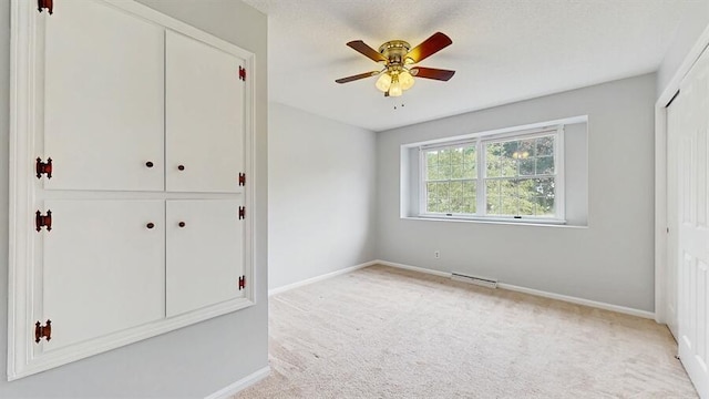 1330 Desmond St, Saint Joseph, MI 49085 - unfurnished bedroom featuring a closet, light carpet, and a ceiling fan