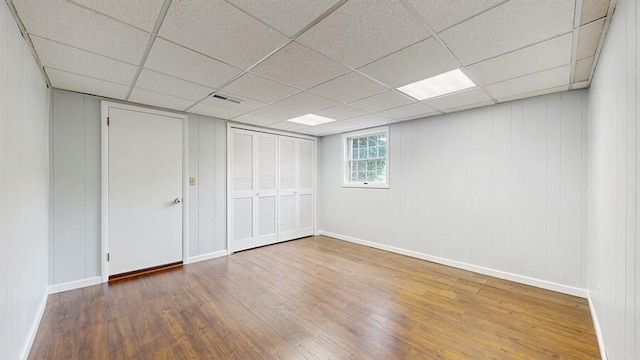 1330 Desmond St, Saint Joseph, MI 49085 - unfurnished bedroom with wood finished floors, a drop ceiling, and a closet