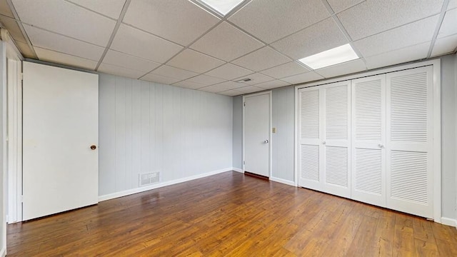 1330 Desmond St, Saint Joseph, MI 49085 - unfurnished bedroom with wood-type flooring, a drop ceiling, and a closet