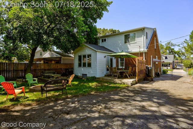 1517 W Troy St, Ferndale, MI 48220 - rear view of property with a fire pit and a wooden deck