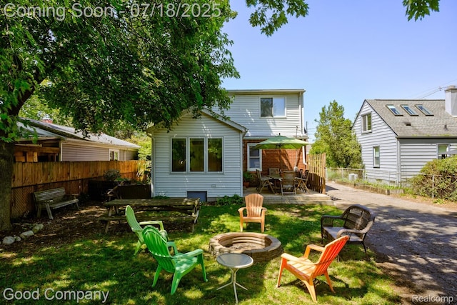 1517 W Troy St, Ferndale, MI 48220 - back of property with an outdoor fire pit, outdoor dining space, and a patio area
