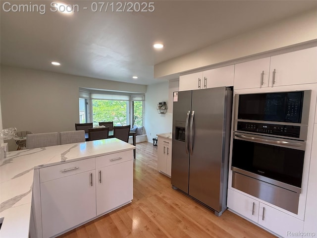 4178 Breckenridge Dr, West Bloomfield, MI 48322 - kitchen with stainless steel appliances, light wood-type flooring, white cabinets, recessed lighting, and light stone counters